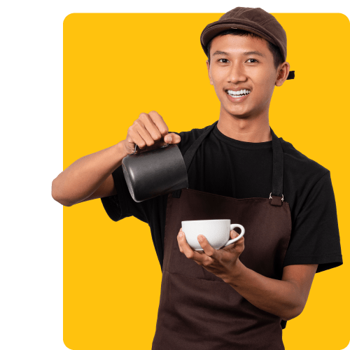 El barista sonriente sirve café